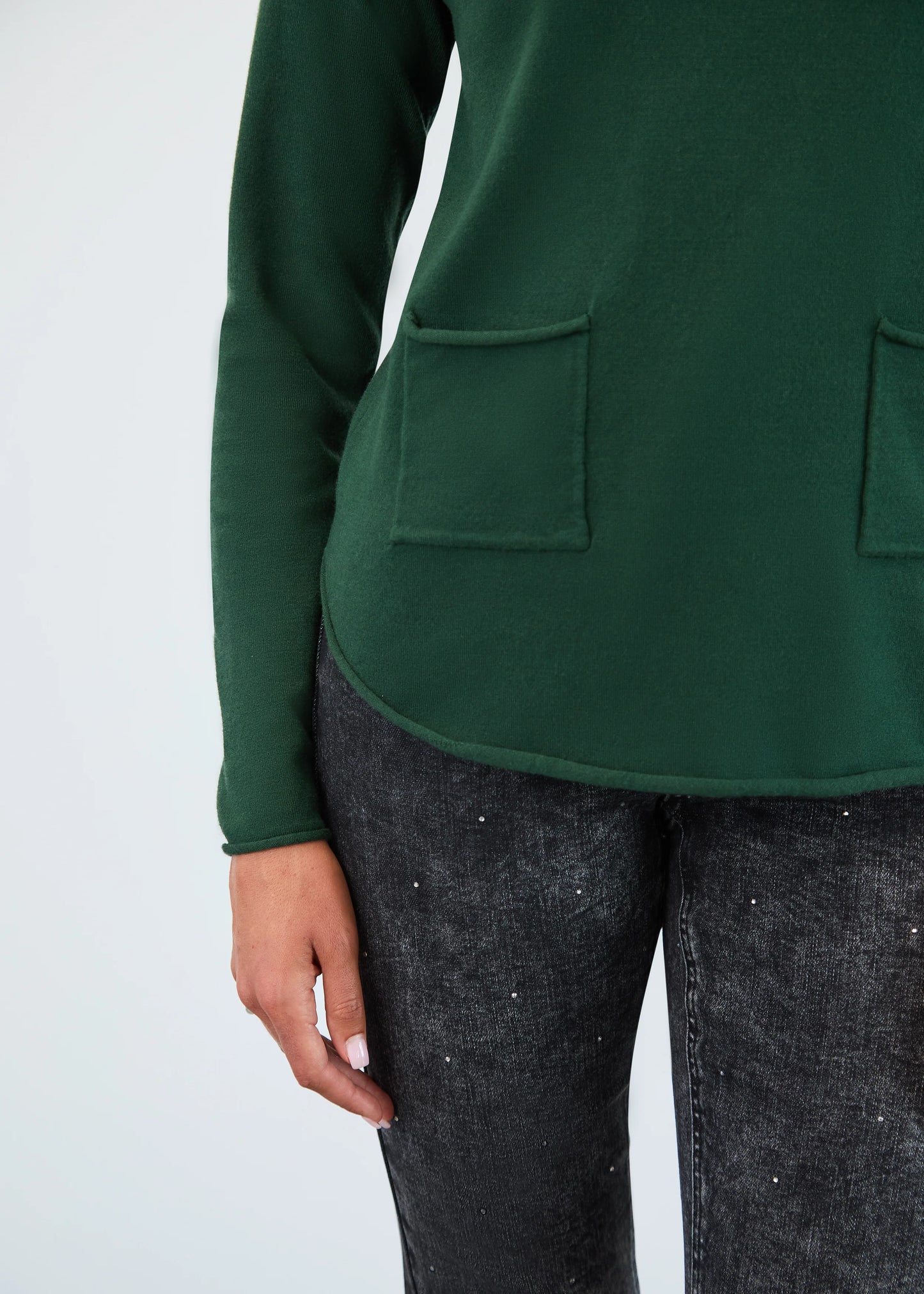 Close-up view of FDJ's cowl neck sweater in Spruce Green, boutique knitwear Canada.