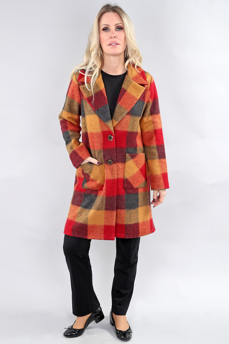 Front view of model wearing gold and red plaid mid-length coat by Michael Tyler.