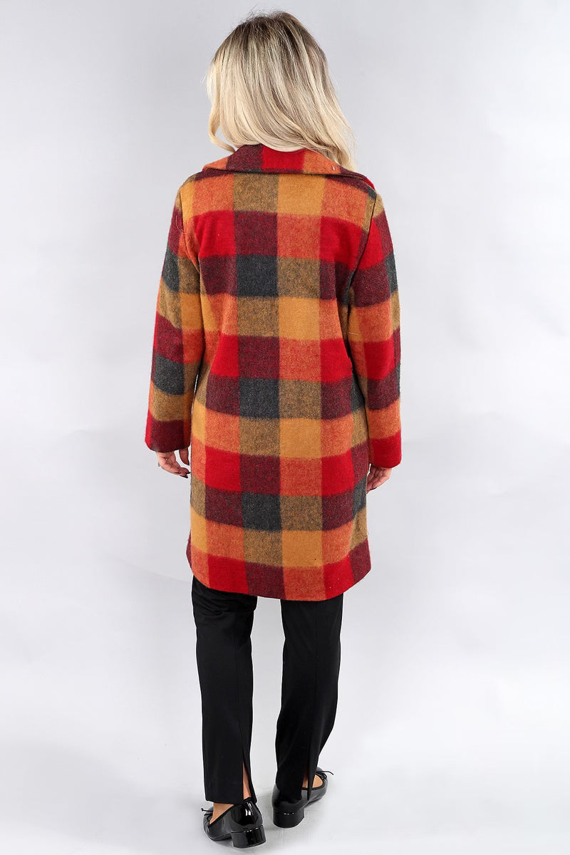 Back view of model wearing gold and red plaid mid-length coat by Michael Tyler.