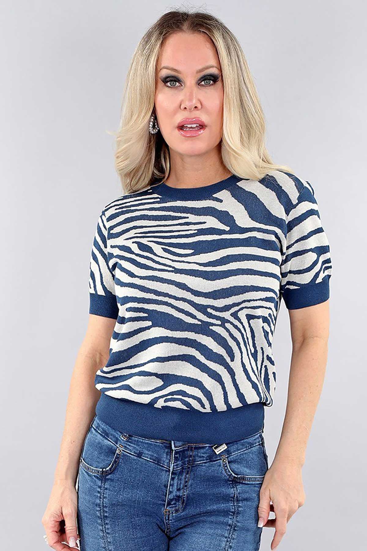 Michael Tyler Short Sleeve Animal Print Sweater in cobalt blue and beige, featuring a bold zebra-inspired design, ribbed hem, and soft sweater knit fabric.