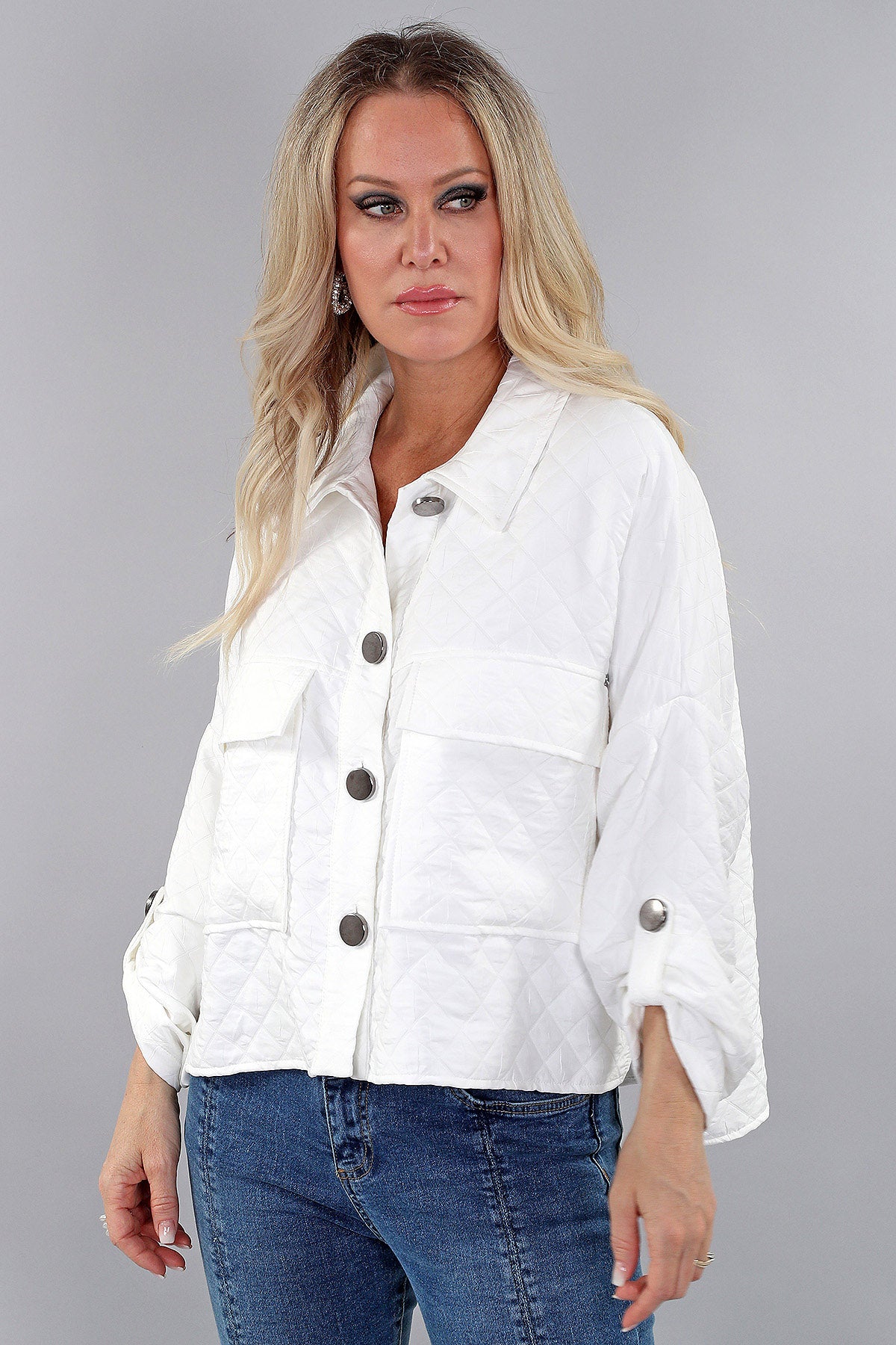 Michael Tyler White Quilted Button-Up Jacket featuring oversized buttons, roll-tab sleeves, and functional front pockets for a chic, structured look.