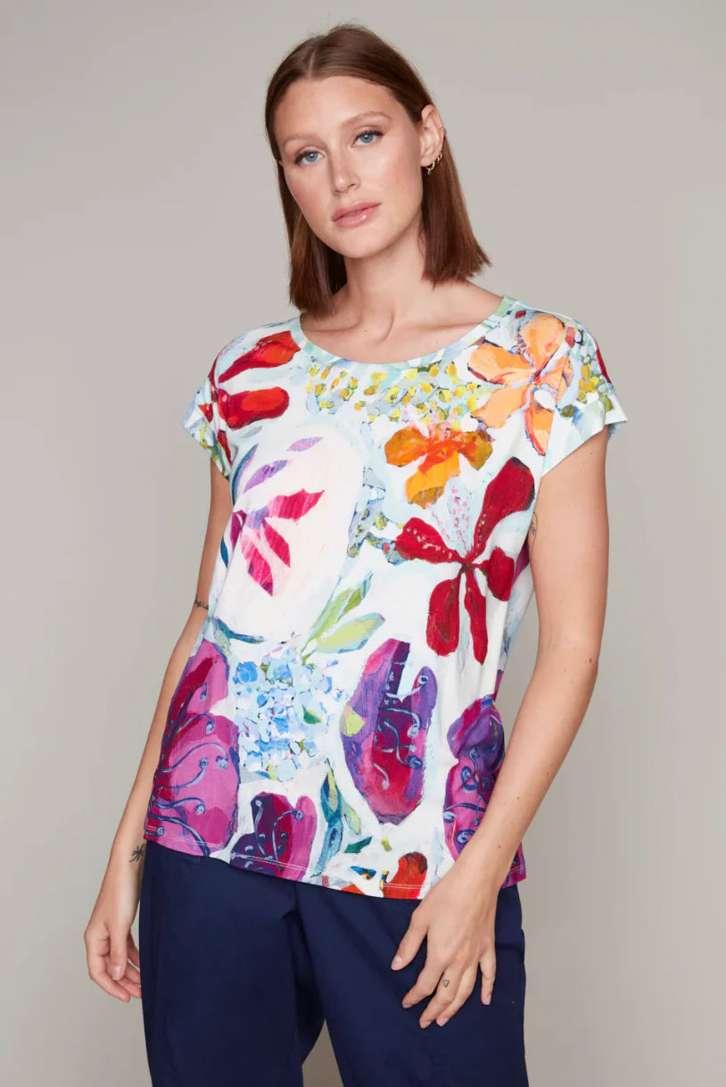 Model wearing a multicolour scoop neck sleeveless tee by Claire Desjardins.