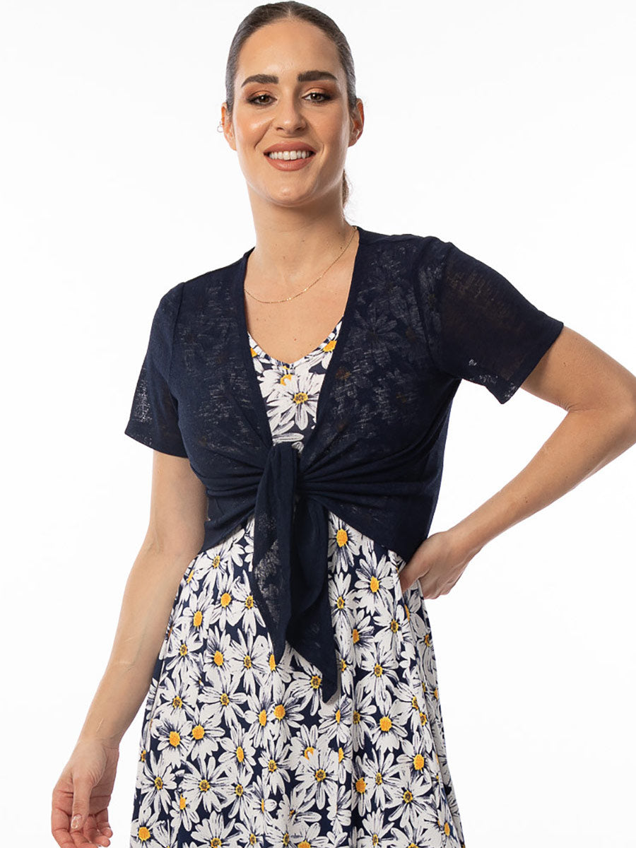 Model wearing Bali's short sleeve bolero in navy tied at front.
