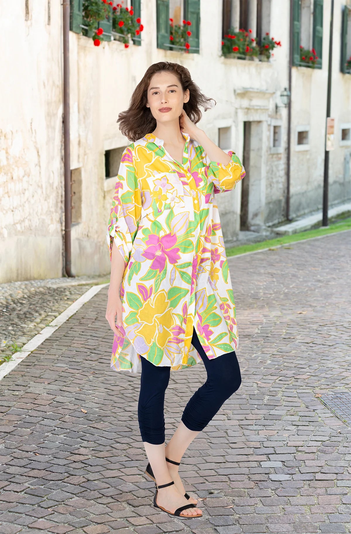 Model wearing Cherishh's half-sleeve floral button-up blouse in soft cotton.