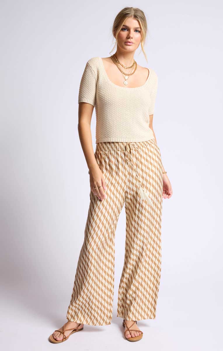 Boho-style wide-leg palazzo pants with an adjustable drawstring waistband