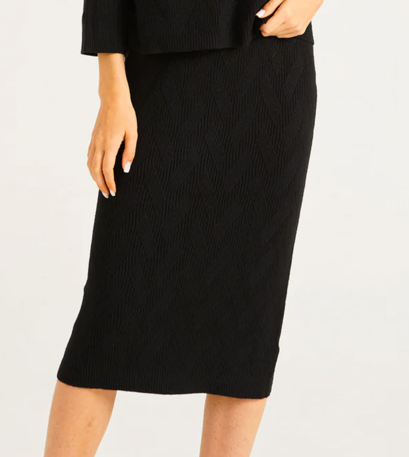 Close-up of ribbed texture on Angeleye black knit skirt.