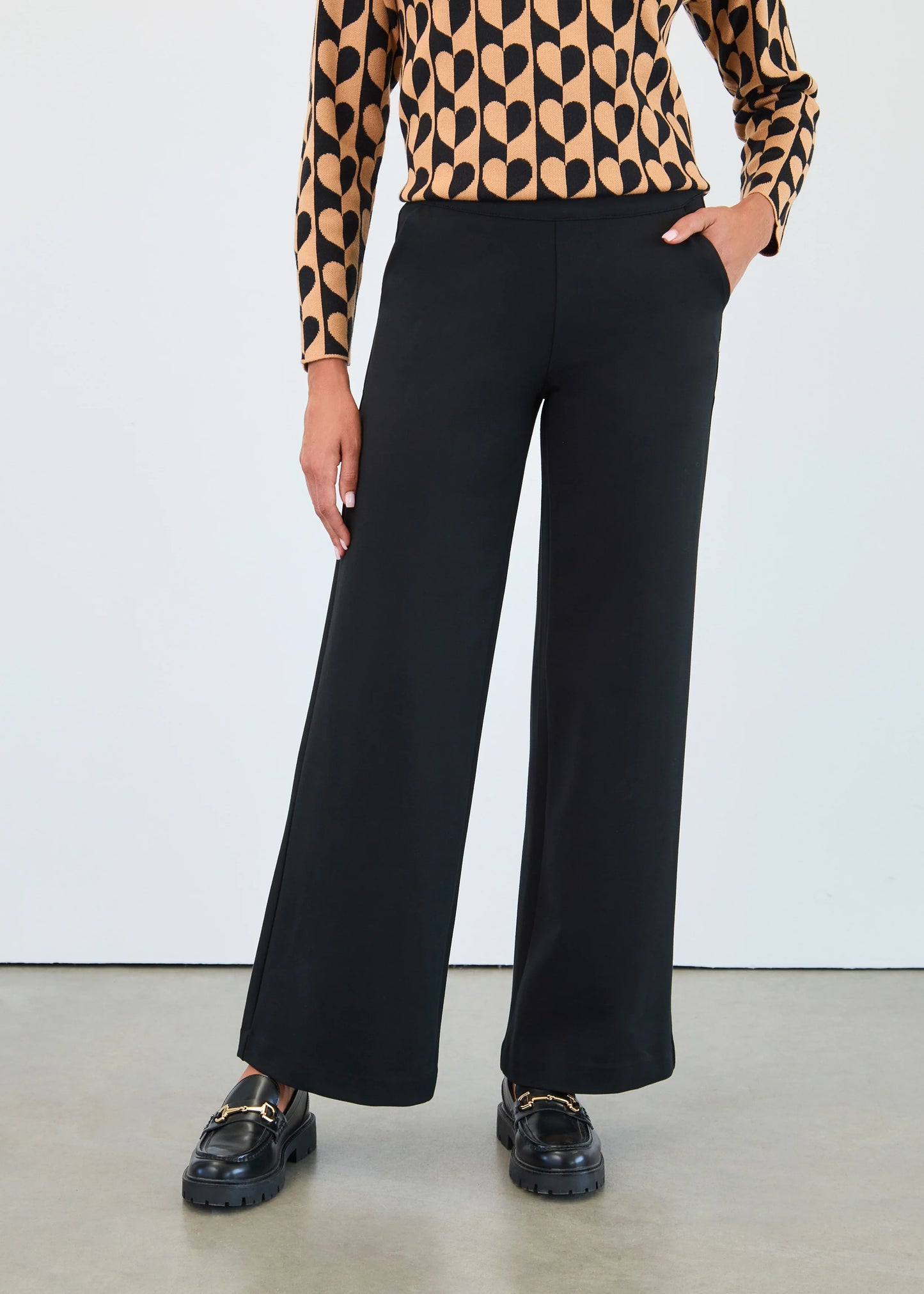 Front view of model in FDJ pull-on wide leg trousers, featuring a sleek and flattering silhouette. Shop Gayle’s Fashions.