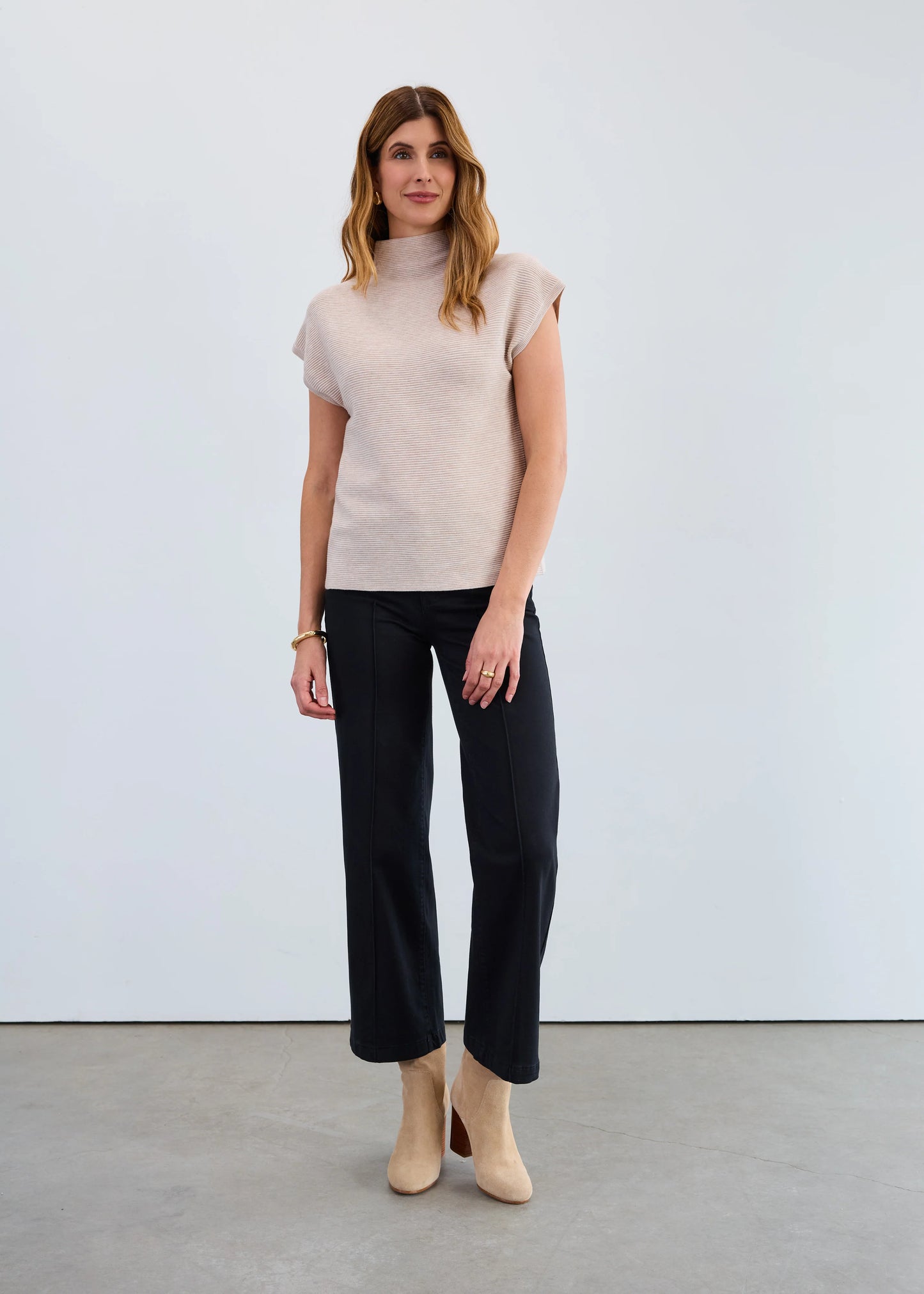 Woman modeling FDJ oat Ottoman sweater vest, boutique sleeveless knit Canada.