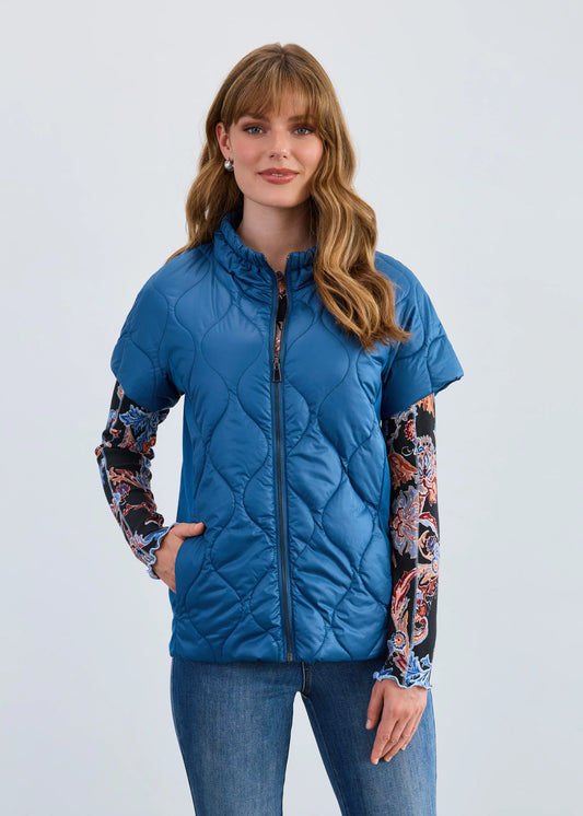 Woman modeling FDJ puff bomber jacket in indigo, boutique Canadian fashion.