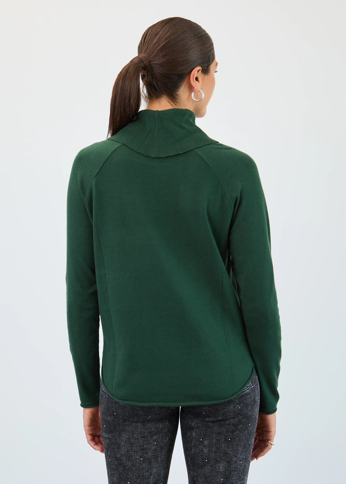Back view of a model wearing the spruce green FDJ sweater with cowl neck and pocket, Gayle’s Fashions Port Alberni.
