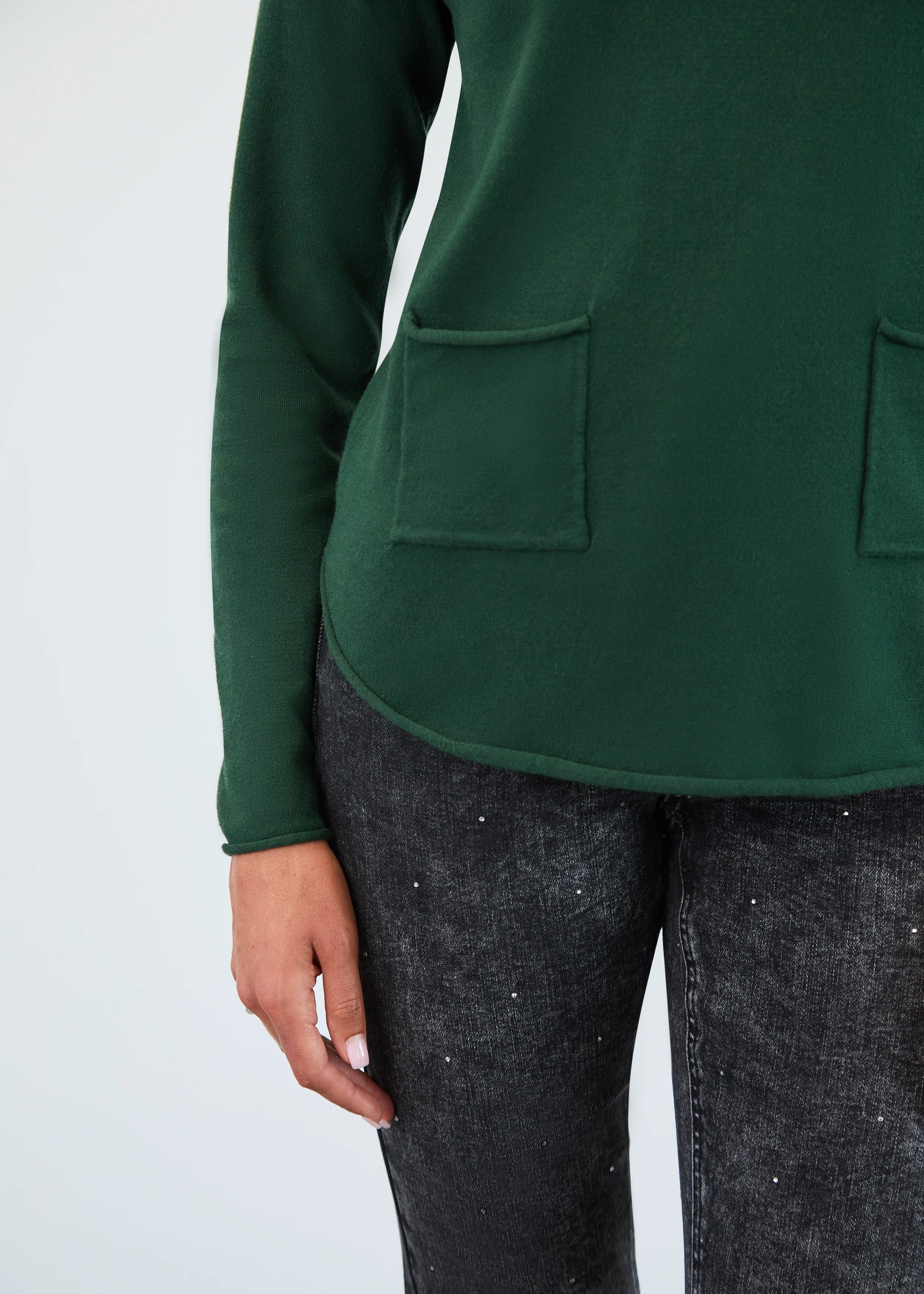 Close-up view of FDJ's cowl neck sweater in Spruce Green, boutique knitwear Canada.