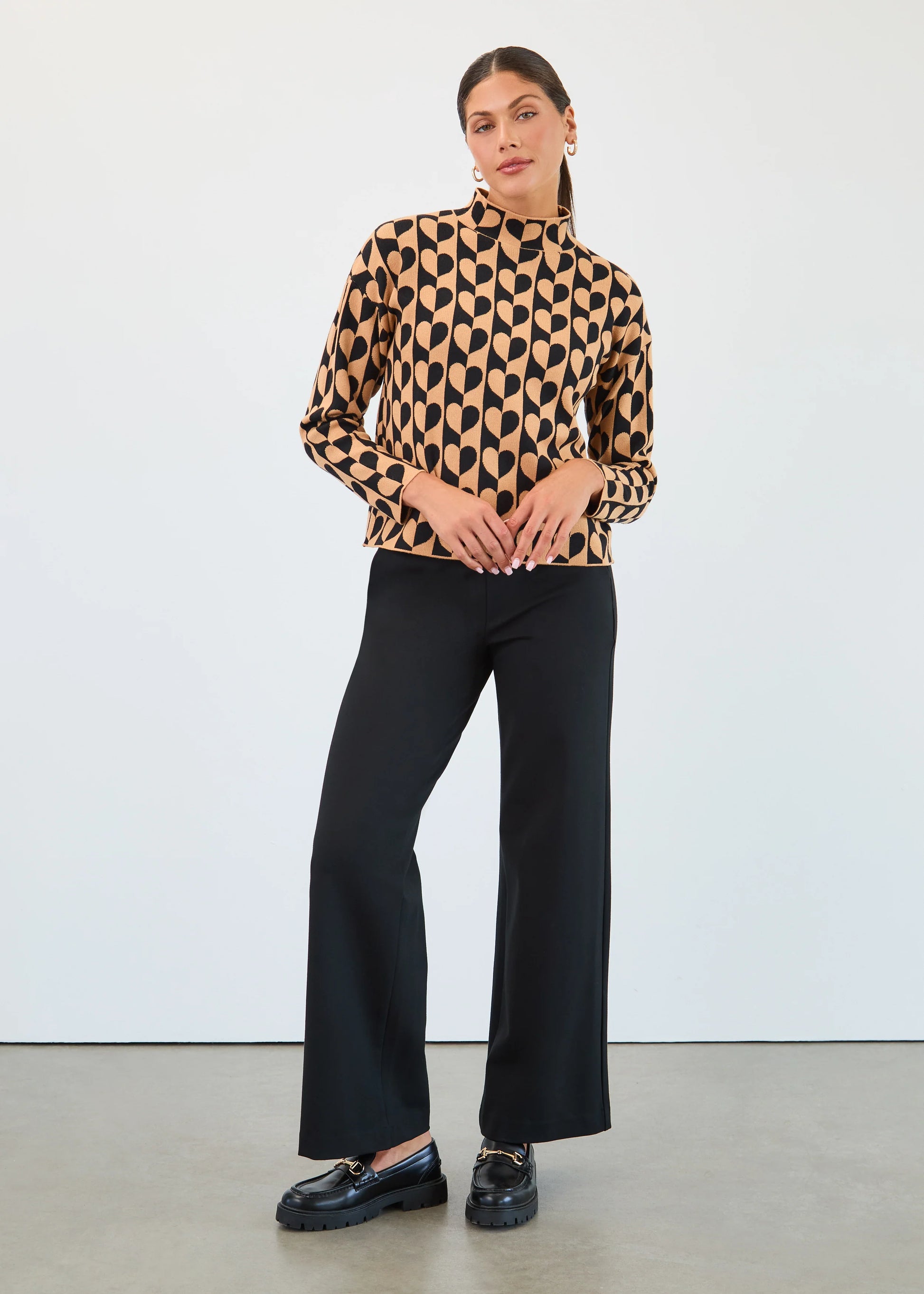 Model wearing FDJ pull-on wide leg pants in classic black, front view. Available at Gayle’s Fashions boutique in Canada.