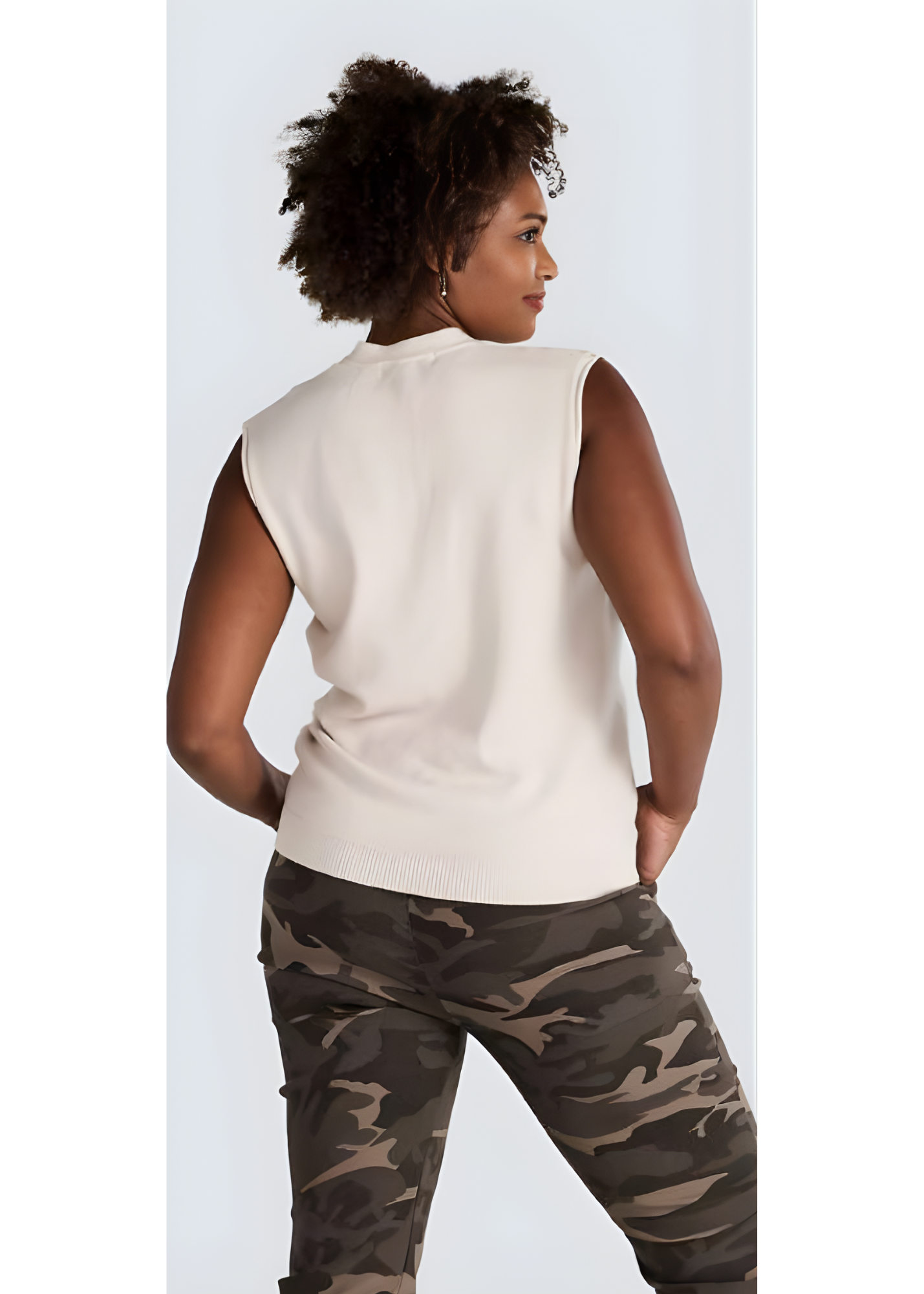 Light beige open-front cardigan vest layered over a white tee from Jessica Laura.