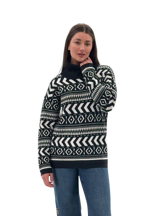 Model wearing Orly black and white knit turtleneck sweater, front view. Available at Gayle’s Fashions boutique in Canada.