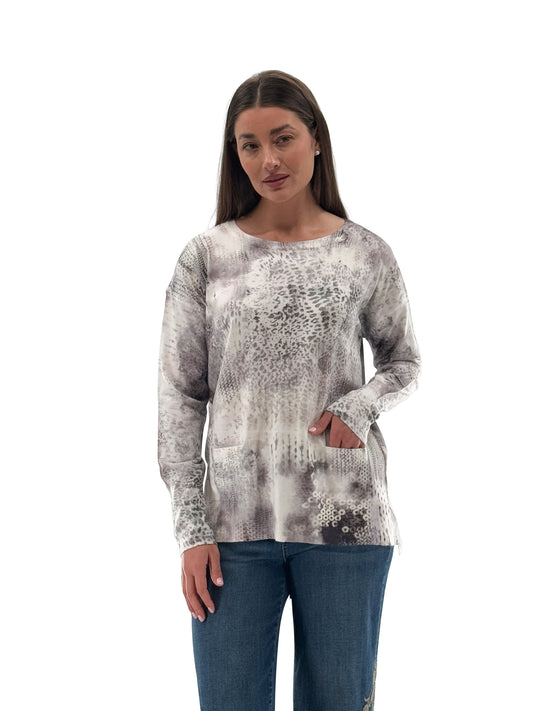 Model wearing Orly cream and grey knit sweater with back button details and front pockets, front view. Available at Gayle’s Fashions boutique in Canada.