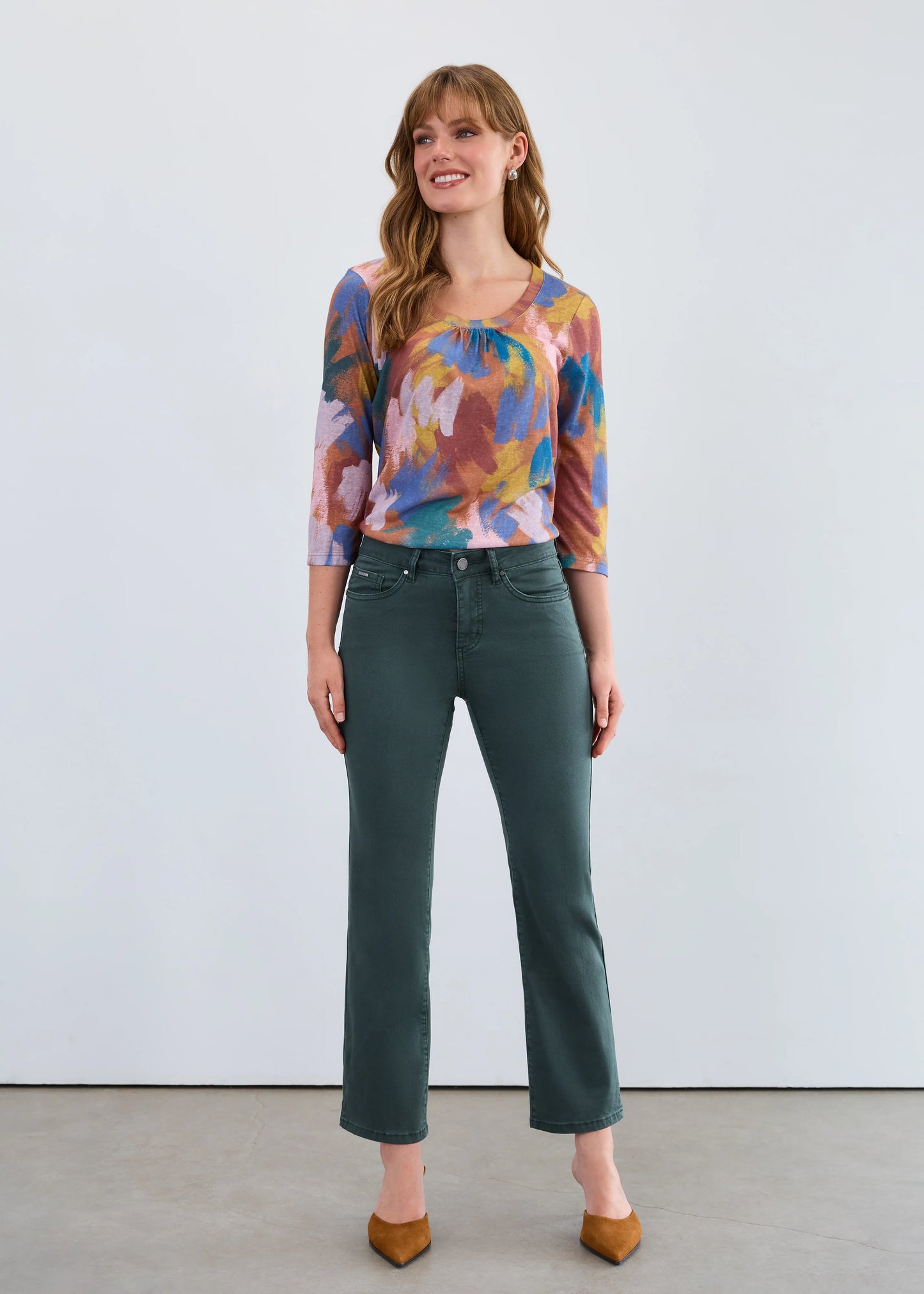 Woman modeling FDJ Olivia boot ankle jeans, spruce colour denim Canada.
