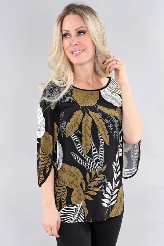 Model wearing black and green leaf pattern ¾ sleeve top by Michael Tyler.