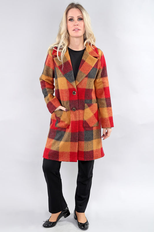 Front view of model wearing gold and red plaid mid-length coat by Michael Tyler.