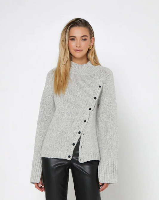 Madison the Label - Annalise Knit Jumper/Sweater. Light grey in colour. Asymmetrical Button Detail in the front. Wider fit arms. Comfortable Fall/Winter essential! 