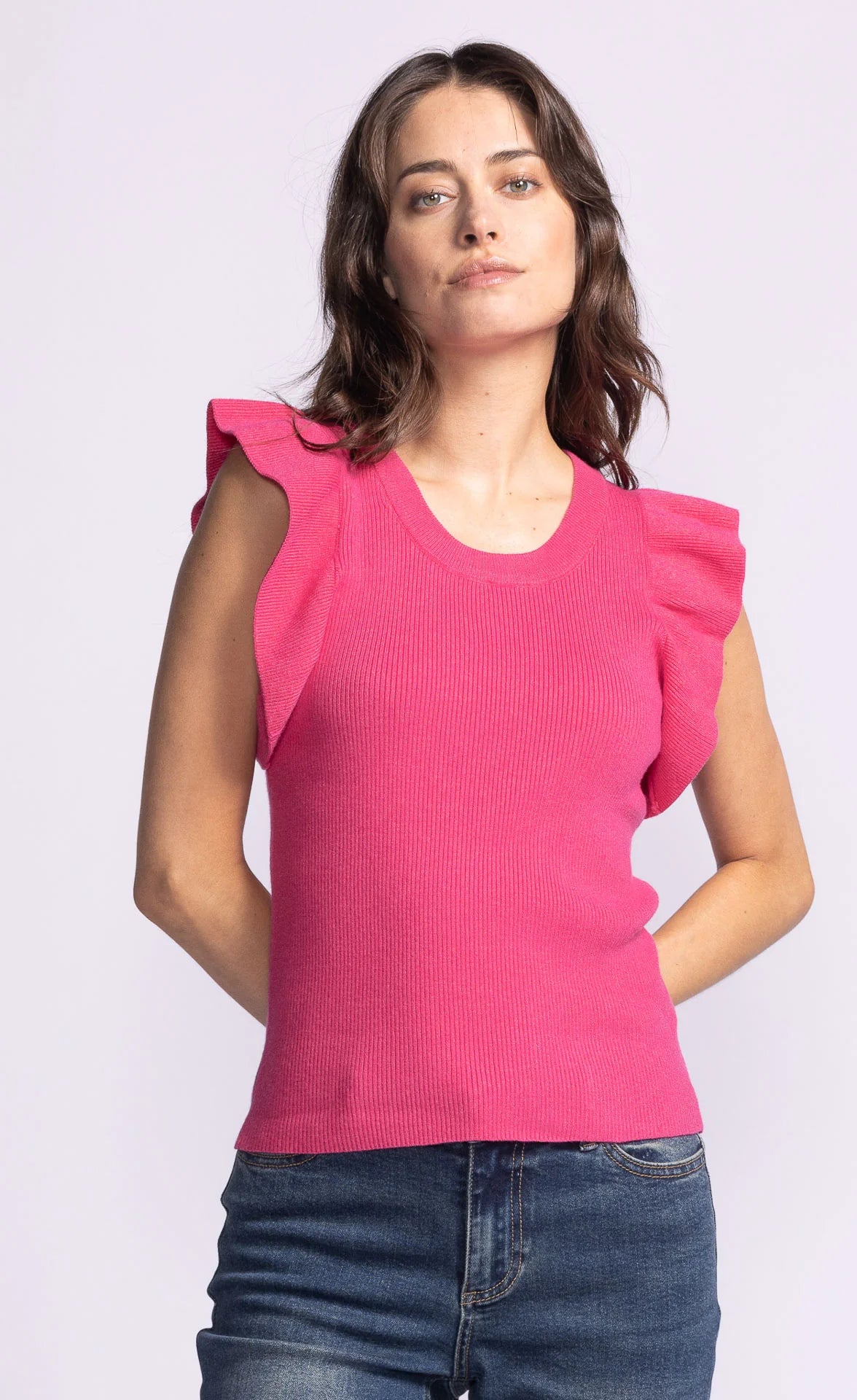 Close-up of the Pink Martini Ruffle Sleeve Knit Top in Fushia, featuring a round neckline and textured fabric.