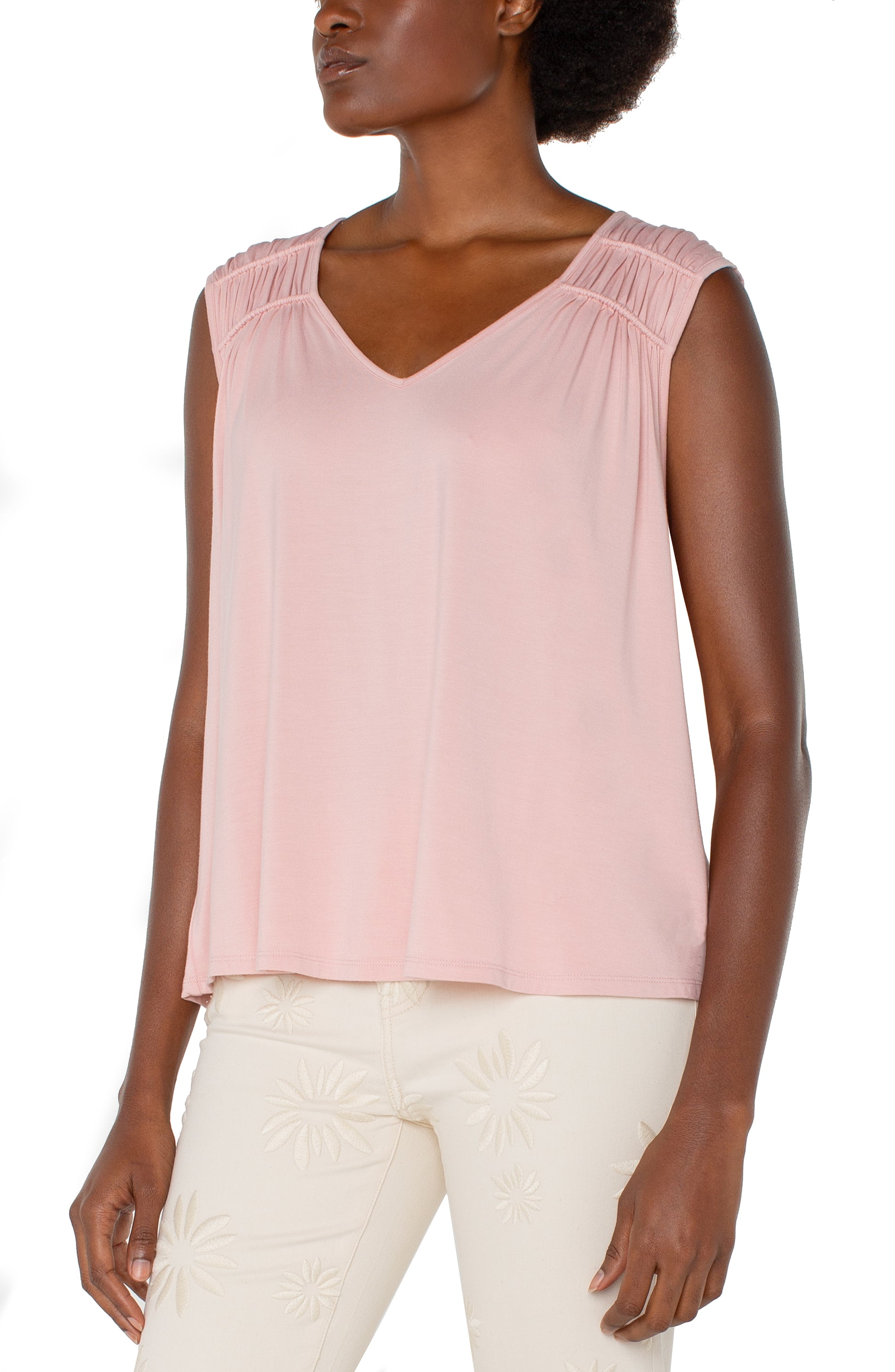 Front view of the Liverpool Sleeveless Shirred Detail Knit Top in Soft Pink, featuring a soft, flowy silhouette with a flattering V-neckline and delicate shirred detailing on the shoulders.