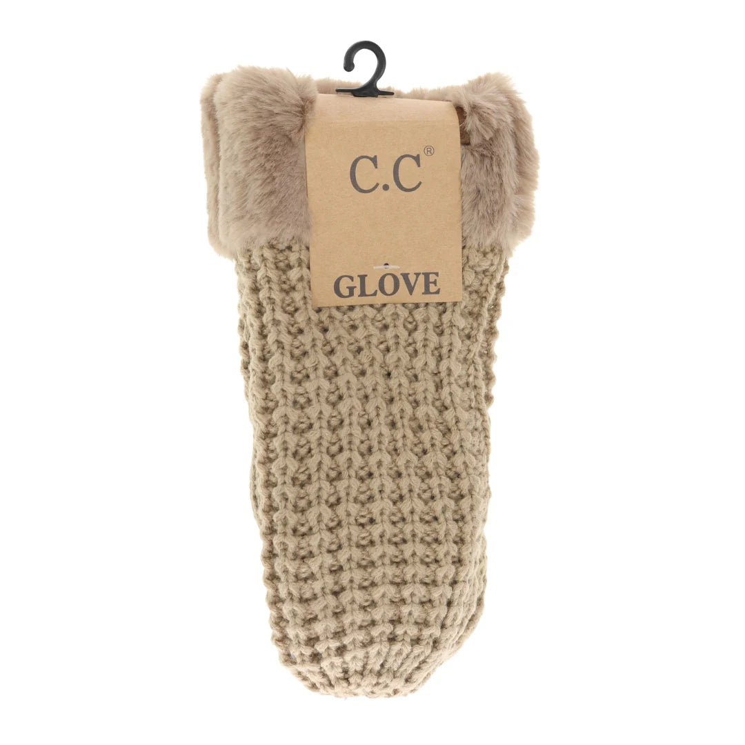 C.C Waffle Knit Mittens in tan with faux fur cuffs, displayed hanging with the product tag attached, showcasing the warm knit texture.