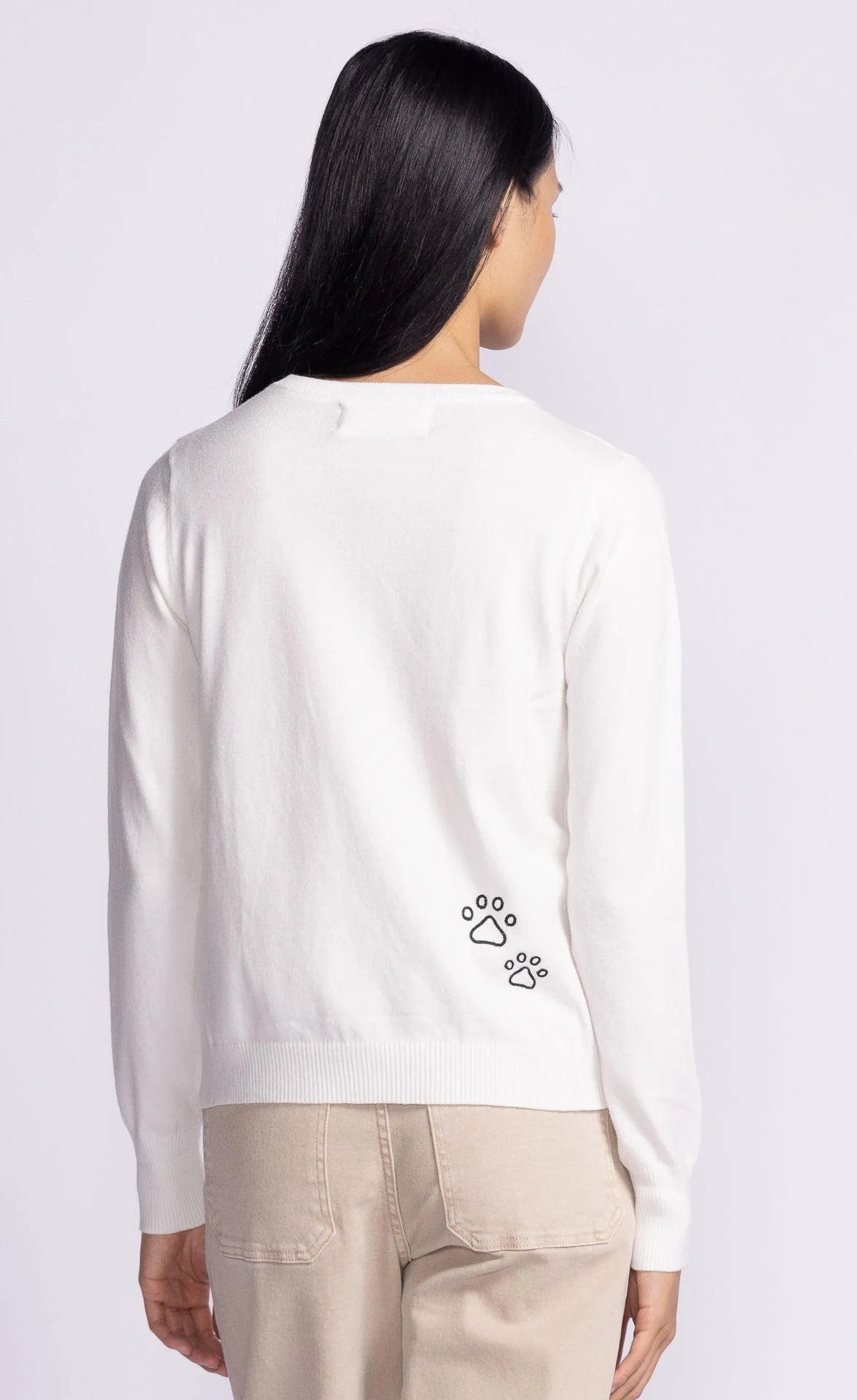 Back view of the Friends Forever Sweater by Pink Martini, featuring a cute paw print embroidery on soft knit fabric.