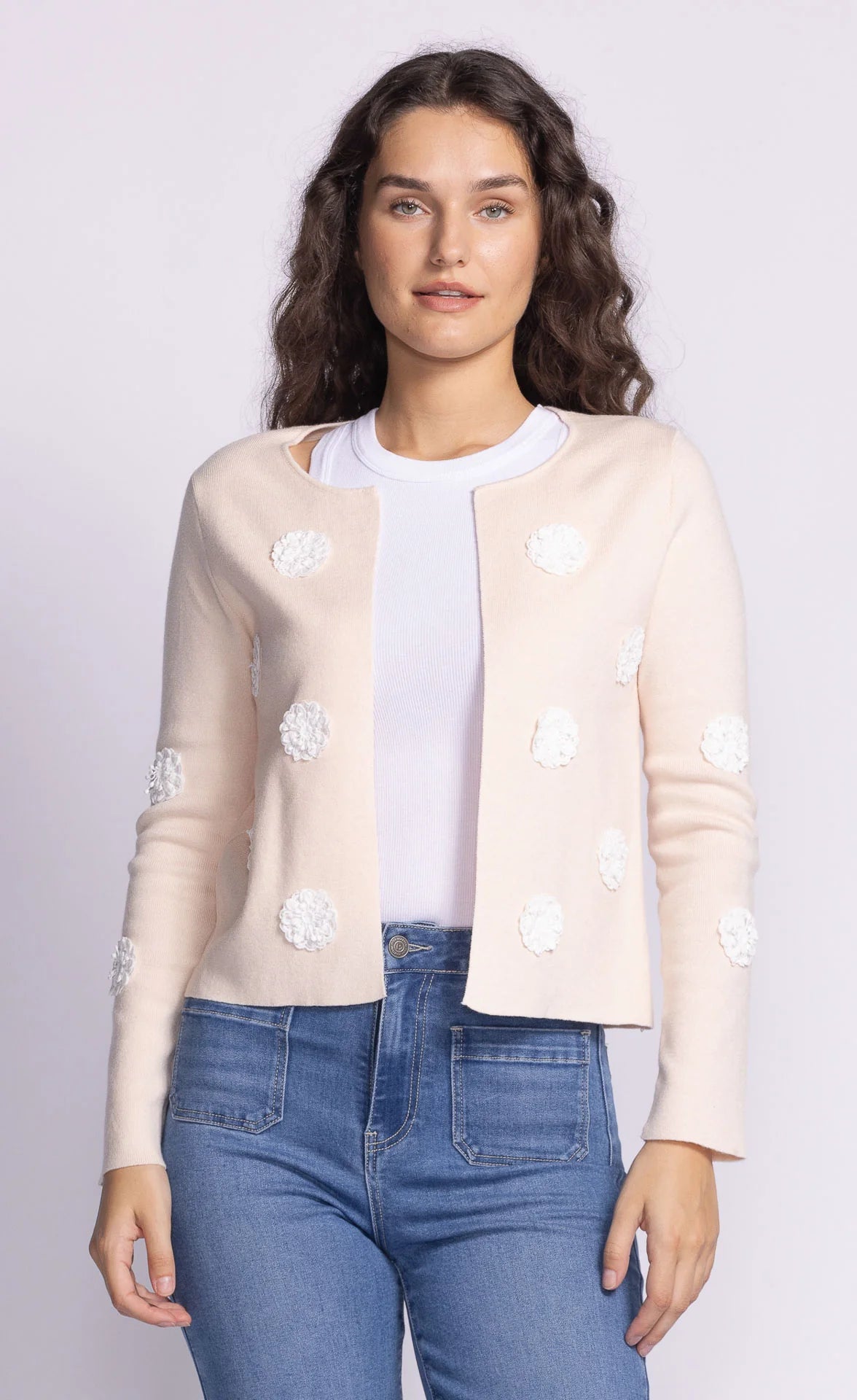 Front view of the Pink Martini Kelsey Sweater in cream, featuring a delicate open-front design with 3D floral appliqué detailing.