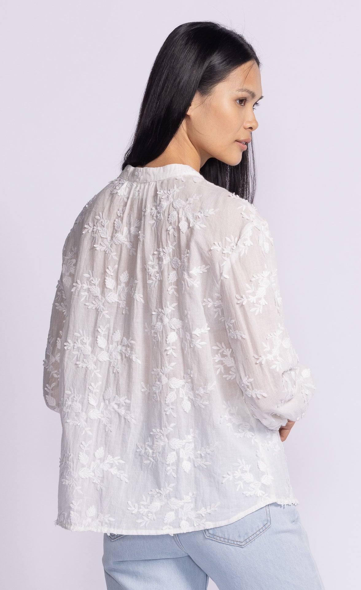 Back view of the Soya Concept Olivia Top in white, highlighting its lightweight, breathable fabric and flowing silhouette.