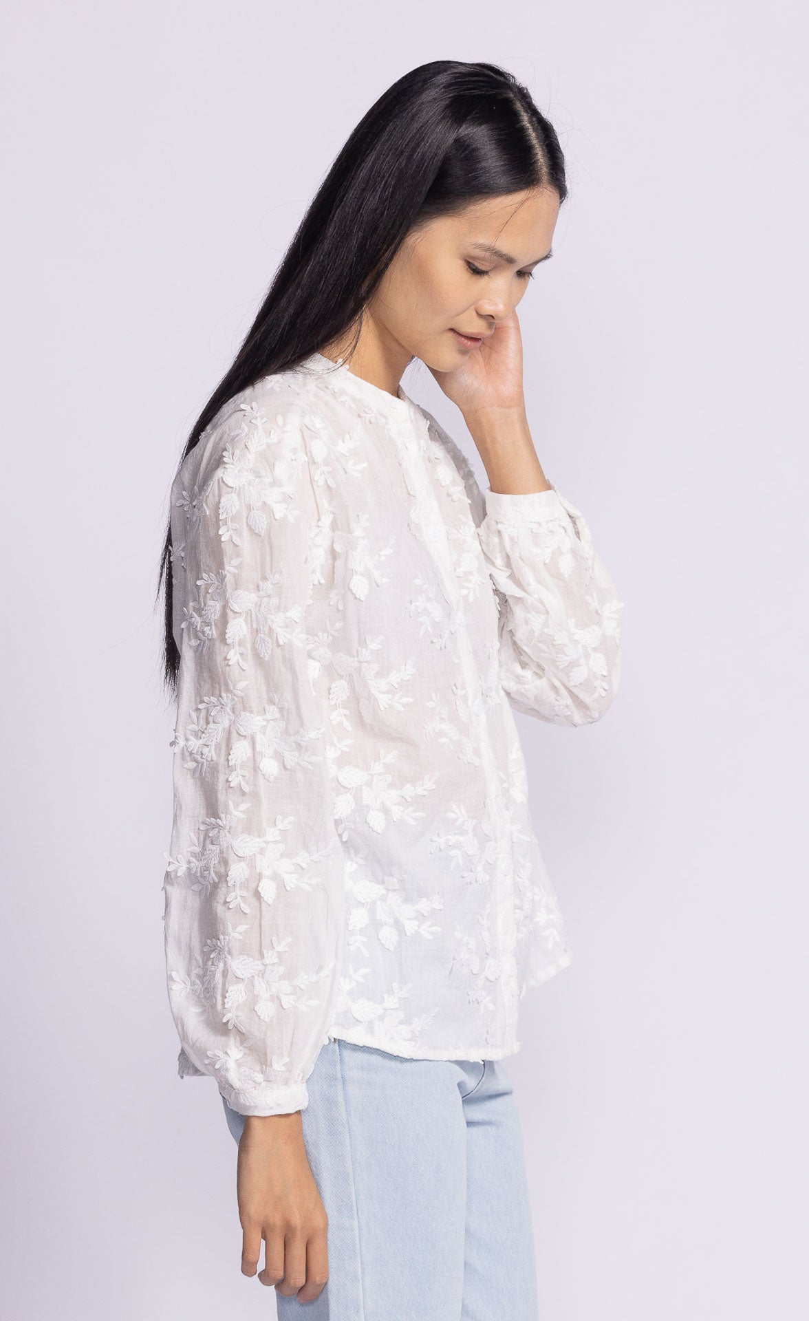 Side profile of the Soya Concept Olivia Top, showcasing its delicate lace details and airy fabric for effortless style.