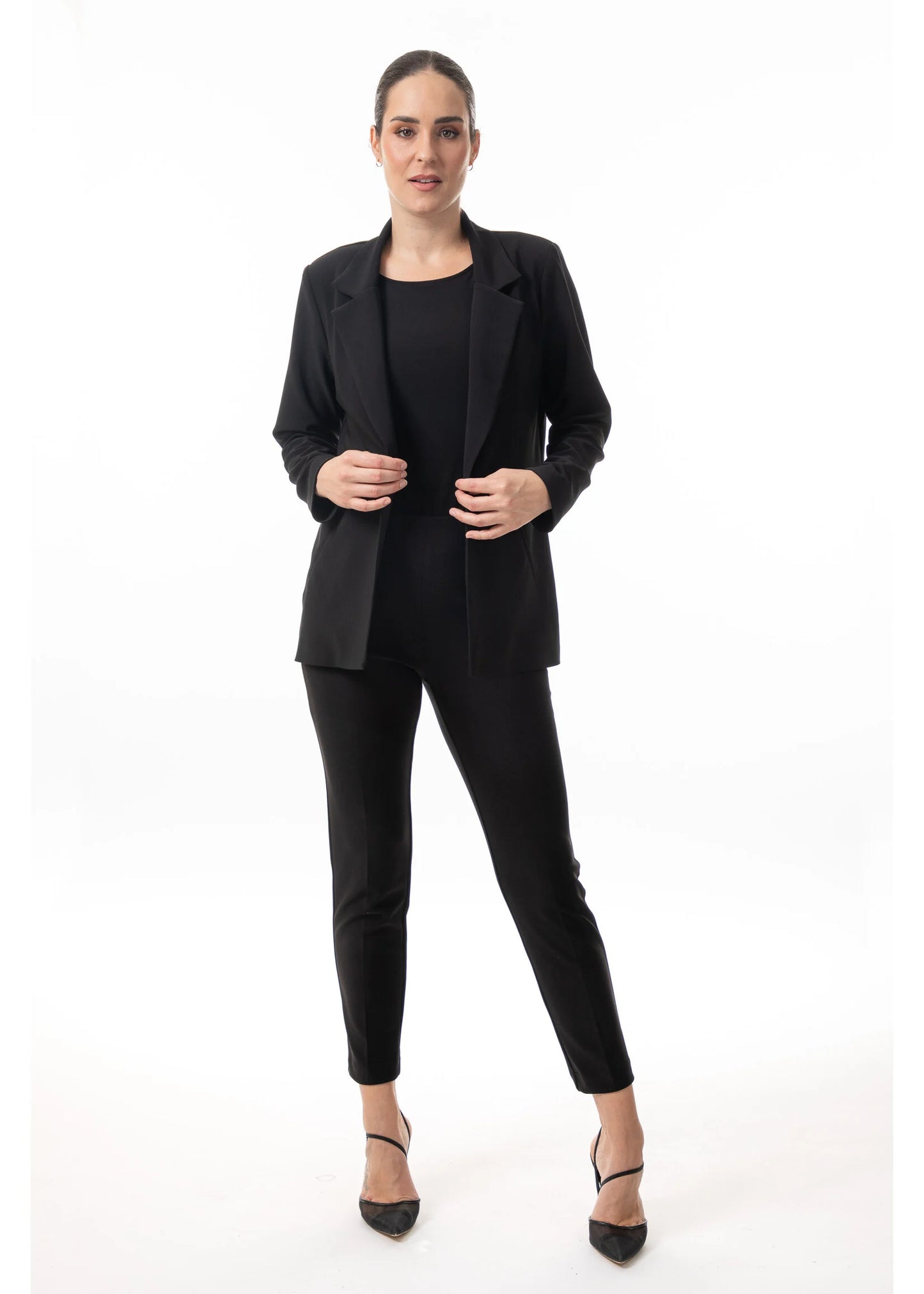 Model wearing the women’s polished layering blazer in black by Bali. Style number 8629.