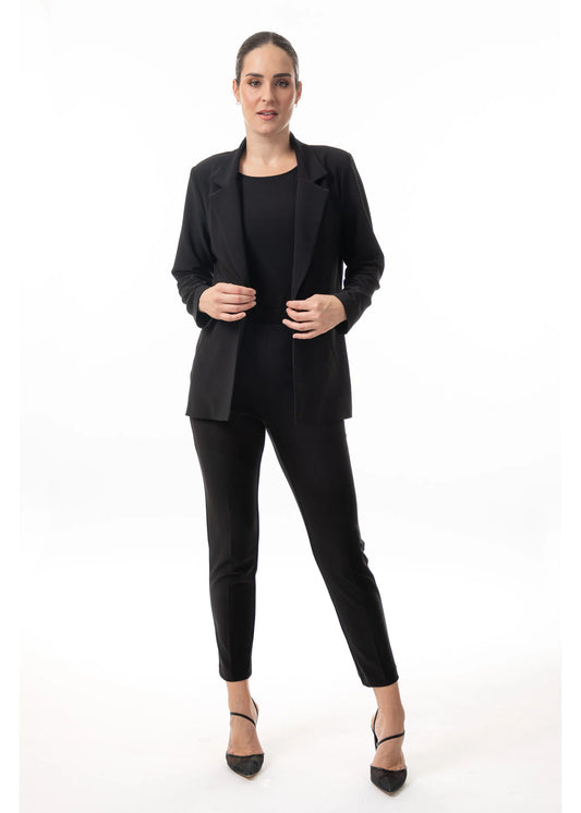 Model wearing the women’s polished layering blazer in black by Bali. Style number 8629.
