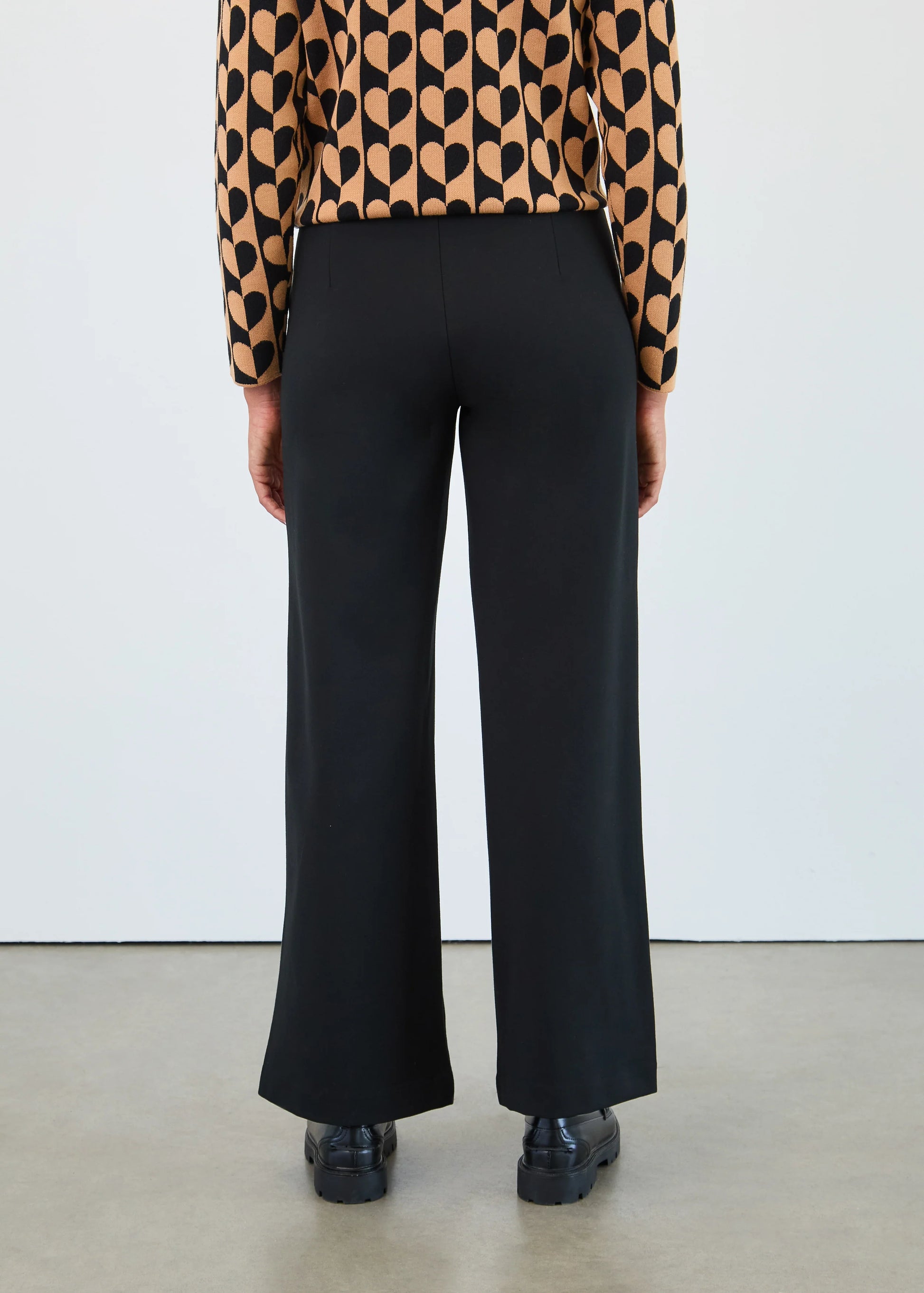 Back view of FDJ 2220396 pull-on wide leg pants in black, highlighting smooth waistband and tailored silhouette. Available in Canada at Gayle’s Fashions.
