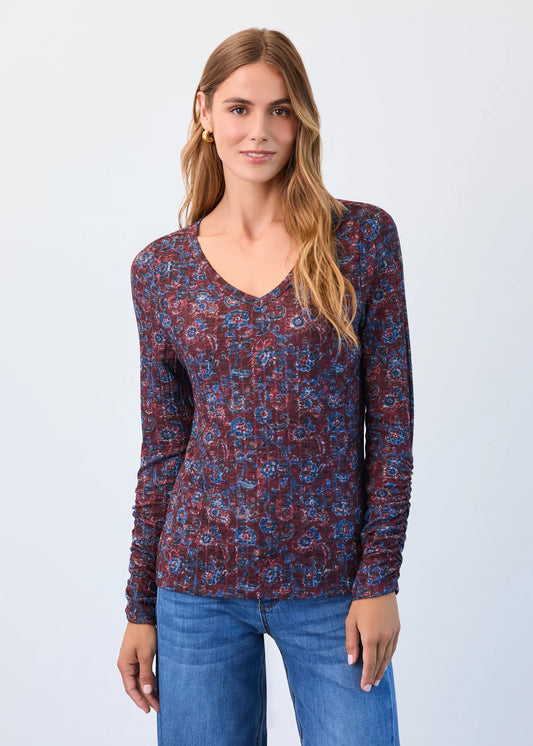 Full front view of model in FDJ v-neck top with rouched sleeves, scarlet crest floral.