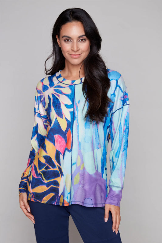Model wearing Claire Desjardins Winter Caress blue long sleeve knit top (92300), front view. Available at Gayle’s Fashions in Canada.